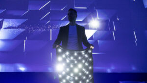 Interactive corporate evening entertainment with digital magic, immersive screen and audience interaction.